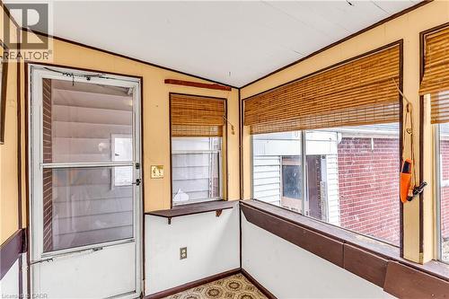View of property's community with ornamental molding and vaulted ceiling - 41 Floral Crescent, Kitchener, ON - Indoor Photo Showing Other Room