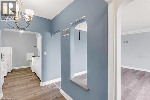 Full bathroom with light wood finished floors, vanity, and hanging lights - 41 Floral Crescent, Kitchener, ON - Indoor Photo Showing Other Room