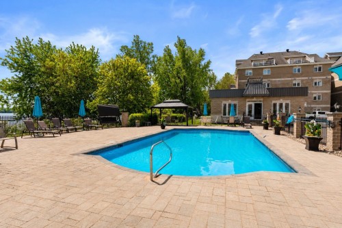 Pool - 202-1324 Rue Notre-Dame, Repentigny (Repentigny), QC - Outdoor With In Ground Pool With Backyard