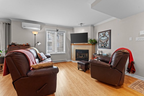 Living Room - 202-1324 Rue Notre-Dame, Repentigny (Repentigny), QC - Indoor Photo Showing Living Room With Fireplace