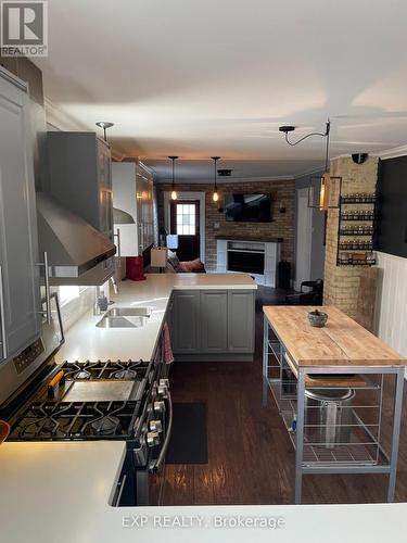 95 Langarth Street E, London South (South B), ON - Indoor Photo Showing Kitchen With Fireplace With Double Sink