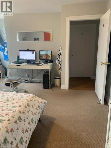 Bedroom with light colored carpet and a desk - 9 Waterloo Avenue, Guelph, ON - Indoor