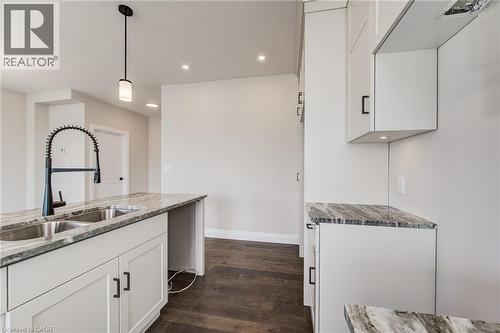 102 Thackeray Way, Harriston, ON - Indoor Photo Showing Kitchen With Double Sink
