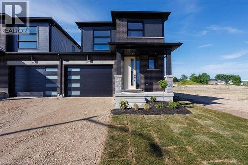 102 Thackeray Way, Harriston, ON - Outdoor With Facade