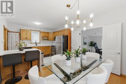 Open kitchen with breakfast bar seating - 148 Conant Street, Oshawa (Lakeview), ON - Indoor Photo Showing Other Room