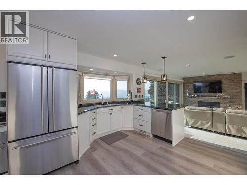 Sink, fridge, eat at counter - 702 Cypress Drive, Coldstream, BC - Indoor Photo Showing Kitchen With Upgraded Kitchen