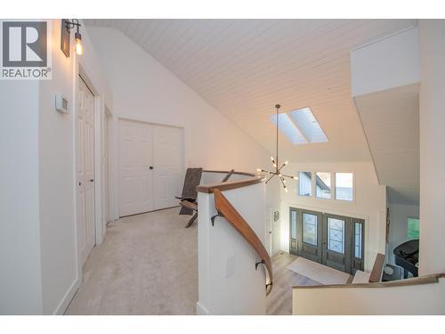 Landing area upstairs - 702 Cypress Drive, Coldstream, BC - Indoor Photo Showing Other Room