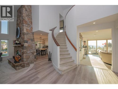 Grand entryway - 702 Cypress Drive, Coldstream, BC - Indoor Photo Showing Other Room With Fireplace