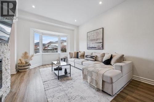 Living Area with Bay Window & Backyard view - 1888 Stevington Crescent, Mississauga, ON - Indoor Photo Showing Living Room With Fireplace