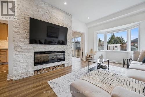 Modern Fireplace on Feature Wall - 1888 Stevington Crescent, Mississauga, ON - Indoor Photo Showing Living Room With Fireplace