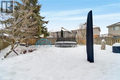 The property features a fenced backyard with mature trees, providing privacy and a sense of enclosure - 191 Hawkswood Trail, Hamilton, ON - Outdoor
