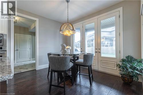 Dining room featuring dark wood-style floors and baseboards - 2719 Torrey Pines Way, London, ON - Indoor Photo Showing Dining Room