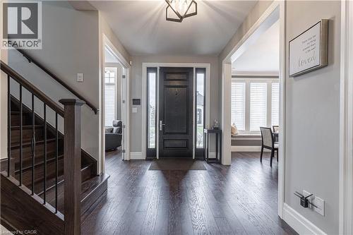 Foyer featuring dark wood finished floors and a chandelier - 2719 Torrey Pines Way, London, ON - Indoor Photo Showing Other Room