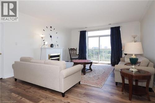 255 Keats Way Unit# 701, Waterloo, ON - Indoor Photo Showing Living Room With Fireplace