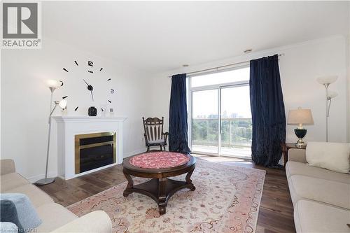 255 Keats Way Unit# 701, Waterloo, ON - Indoor Photo Showing Living Room With Fireplace