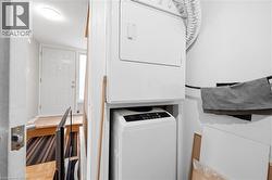 Laundry area with stacked washer and dryer - 