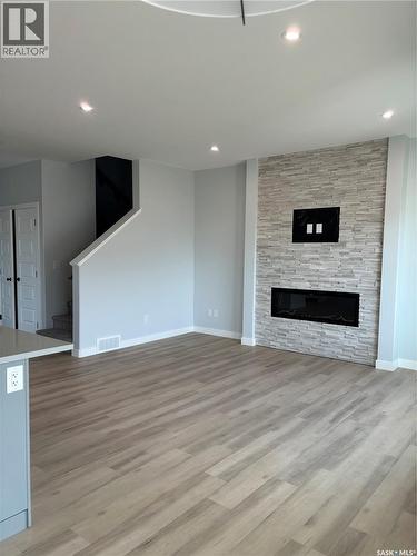 438 Leskiw Bend, Saskatoon, SK - Indoor Photo Showing Living Room With Fireplace