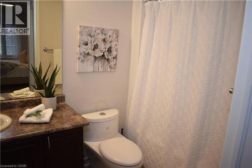 Bathroom featuring ensuite bathroom, vanity, and a shower with curtain - 776 Laurelwood Drive Unit# 406, Waterloo, ON - Indoor Photo Showing Bathroom