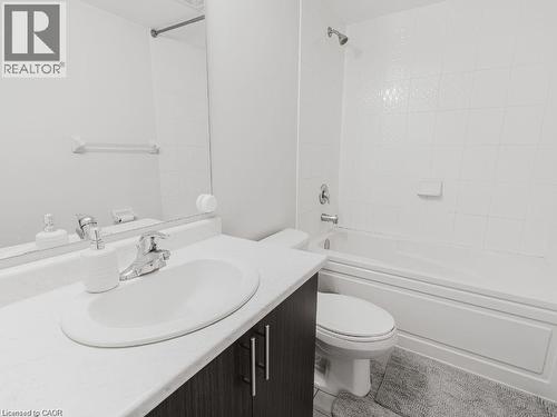 Bathroom featuring vanity, shower / bathtub combination, and light tile patterned flooring - 1206 Main Street E Unit# 113, Milton, ON - Indoor Photo Showing Bathroom