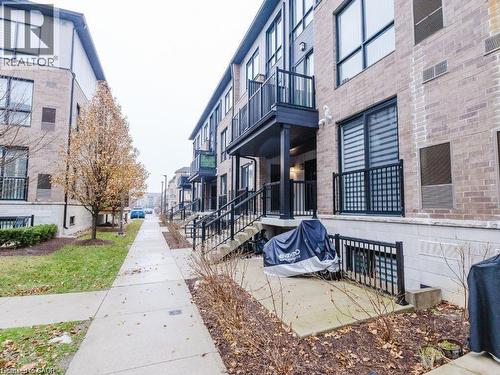 View of community featuring a balcony and a patio area - 1206 Main Street E Unit# 113, Milton, ON - Outdoor