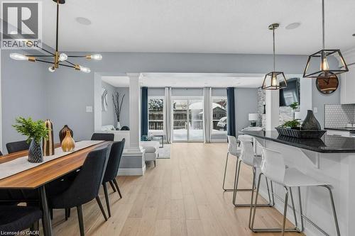 Stunning mainfloor with upgraded kitchen, new flooring, patio door walkout, and more! - 26 Helena Feasby Street, Kitchener, ON - Indoor Photo Showing Dining Room