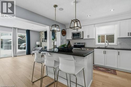 Kitchen island with seating - 26 Helena Feasby Street, Kitchener, ON - Indoor Photo Showing Kitchen With Upgraded Kitchen