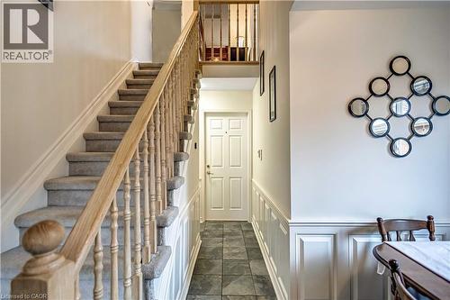 Staircase featuring wainscoting and a decorative wall - 640 Acadia Drive, Hamilton, ON - Indoor Photo Showing Other Room