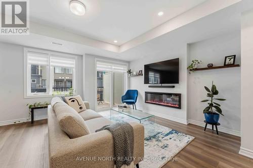 419 Pilot Private, Ottawa, ON - Indoor Photo Showing Living Room With Fireplace