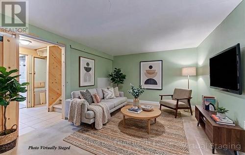 **photo virtually staged - 828 Elgin Street N, Cambridge, ON - Indoor Photo Showing Living Room