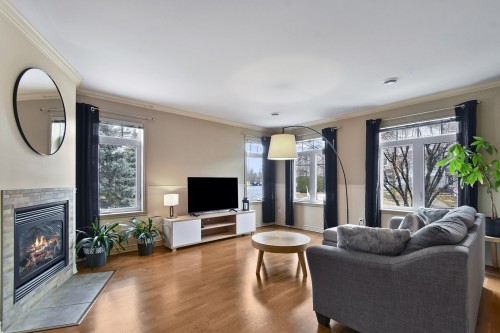 Salon - 102-50 37E Avenue E., Blainville, QC - Indoor Photo Showing Living Room With Fireplace