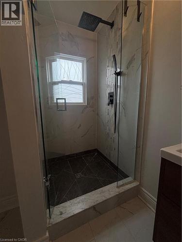 Full bathroom with vanity, a marble finish shower, and dark marble finish floors - 37 Cliff Avenue, Hamilton, ON - Indoor