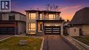 View of front of home with stone siding, driveway, a garage, and a yard - 2556 Glengarry Road, Mississauga, ON  - Outdoor 