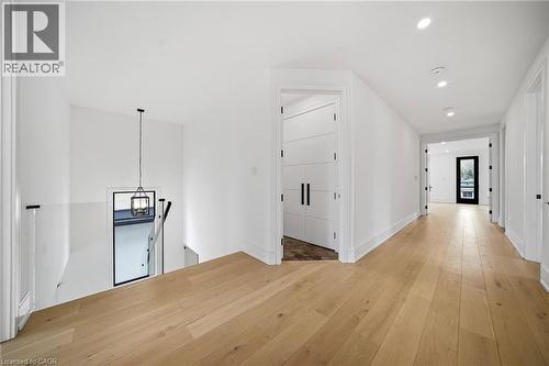Hall featuring an upstairs landing, light wood finished floors, and recessed lighting - 2556 Glengarry Road, Mississauga, ON - Indoor Photo Showing Other Room