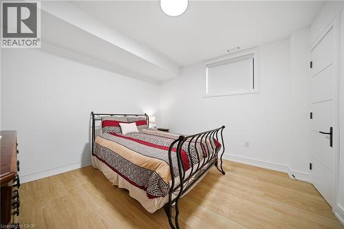 Bedroom with light wood-style flooring and baseboards - 2556 Glengarry Road, Mississauga, ON - Indoor Photo Showing Bedroom