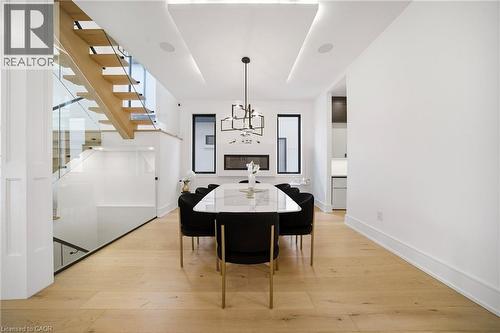 Dining space featuring light wood-type flooring and a chandelier - 2556 Glengarry Road, Mississauga, ON - Indoor Photo Showing Dining Room
