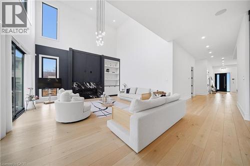 Living area with light wood-style flooring, a high ceiling, and recessed lighting - 2556 Glengarry Road, Mississauga, ON - Indoor Photo Showing Living Room