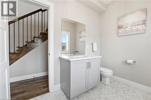 Half bathroom featuring baseboards and vanity - 39 Mill Race Crescent, St. Jacobs, ON - Indoor Photo Showing Bathroom