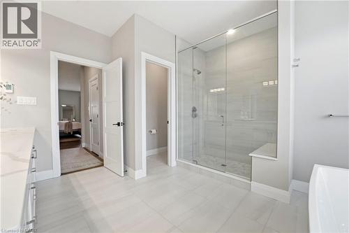 Full bath featuring vanity, a freestanding tub, ensuite bathroom, and a shower stall - 39 Mill Race Crescent, St. Jacobs, ON - Indoor Photo Showing Other Room