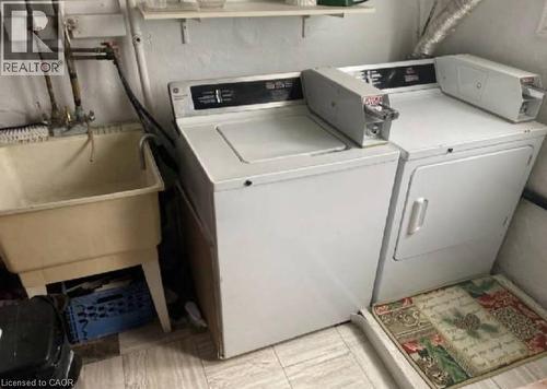 Coin operated laundry for all tenant - 31 Southdale Avenue, Kitchener, ON - Indoor Photo Showing Laundry Room