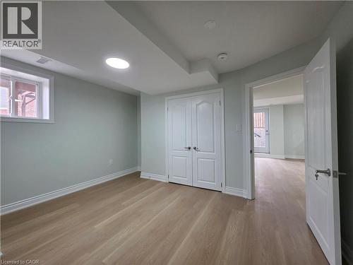 Unfurnished bedroom with light wood-type flooring and a closet - 367 Equestrian Way Unit# Basement, Cambridge, ON - Indoor Photo Showing Other Room