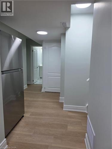 Hallway with light wood-style flooring and baseboards - 367 Equestrian Way Unit# Basement, Cambridge, ON - Indoor Photo Showing Other Room