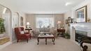 116-650 Lexington Drive, Kelowna, BC  - Indoor Photo Showing Living Room With Fireplace 