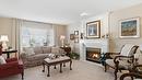 116-650 Lexington Drive, Kelowna, BC  - Indoor Photo Showing Living Room With Fireplace 