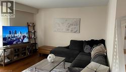 Living room featuring wood finished floors - 