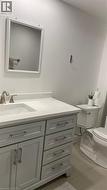 Bathroom with toilet and vanity - 
