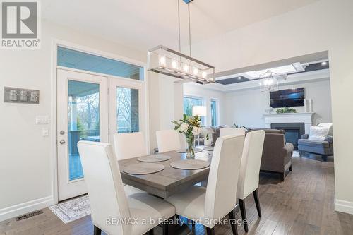 30 Brookside Lane, Tillsonburg, ON - Indoor Photo Showing Dining Room With Fireplace