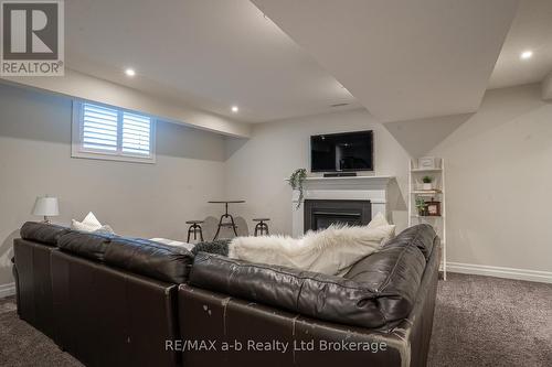 30 Brookside Lane, Tillsonburg, ON - Indoor Photo Showing Basement With Fireplace
