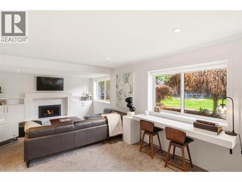 TV room - 4337 Dunvegan Court, Kelowna, BC - Indoor Photo Showing Living Room With Fireplace
