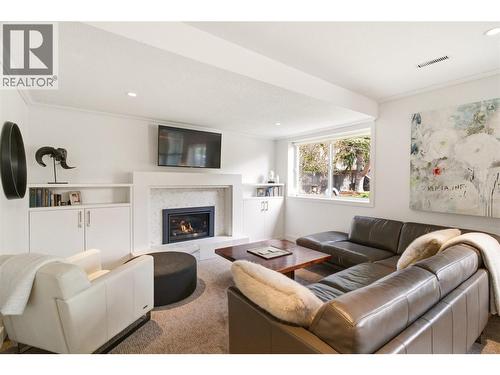 TV room - 4337 Dunvegan Court, Kelowna, BC - Indoor Photo Showing Living Room With Fireplace