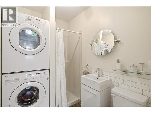 Lower level 3 piece bathroom with laundry - 4337 Dunvegan Court, Kelowna, BC - Indoor Photo Showing Laundry Room